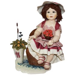 Фарфоровая статуэтка Девочка с цветами сидящая в кресле