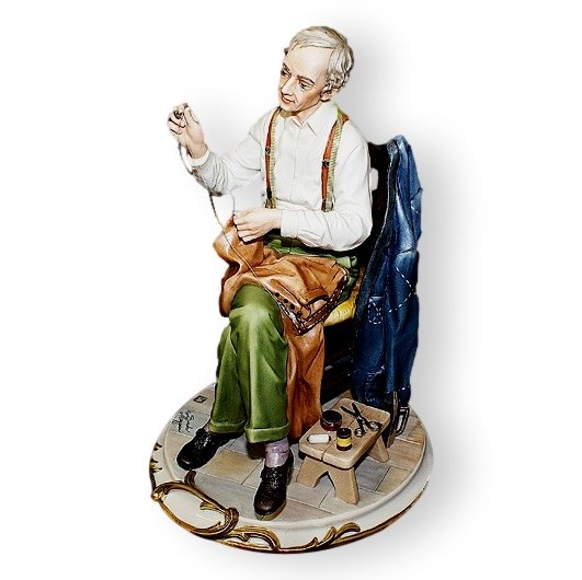 Фарфоровая статуэтка Портной