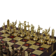 Шахматы Троянская война, красная доска, фигуры бронзовые Manopoulos MP-S-4-C-36-RED, фотография золотых фигур на доске